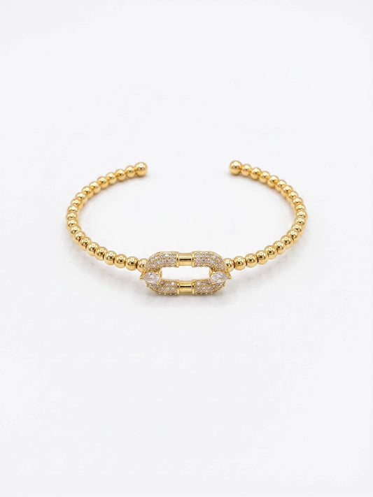 Close-up of Gold Beaded Bracelet with Crystal Link