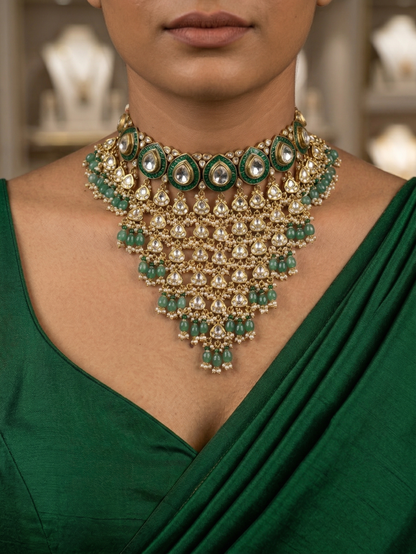 Premium Kundan Jhalar choker set featuring intricate gold-plated fringe work and white pearl hangings