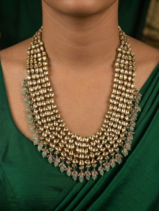 Antique gold-plated Mughal Kundan necklace set featuring intricate floral patterns