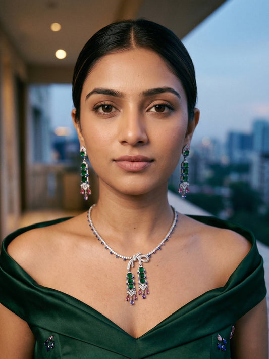 Woman wearing green and silver jewelry with a blurred cityscape background