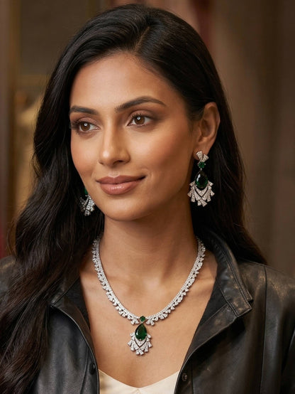 Woman wearing a necklace and earrings with a blurred background
