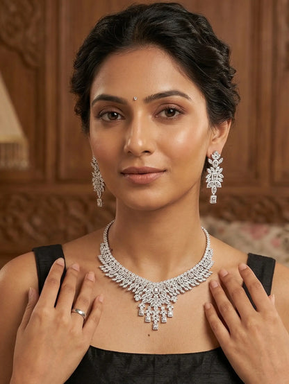 Woman wearing a diamond necklace and earrings with a wooden panel background