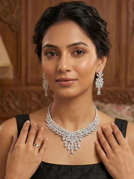 Woman wearing a diamond necklace and earrings with a wooden panel background