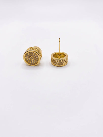 Gold earrings on a white background