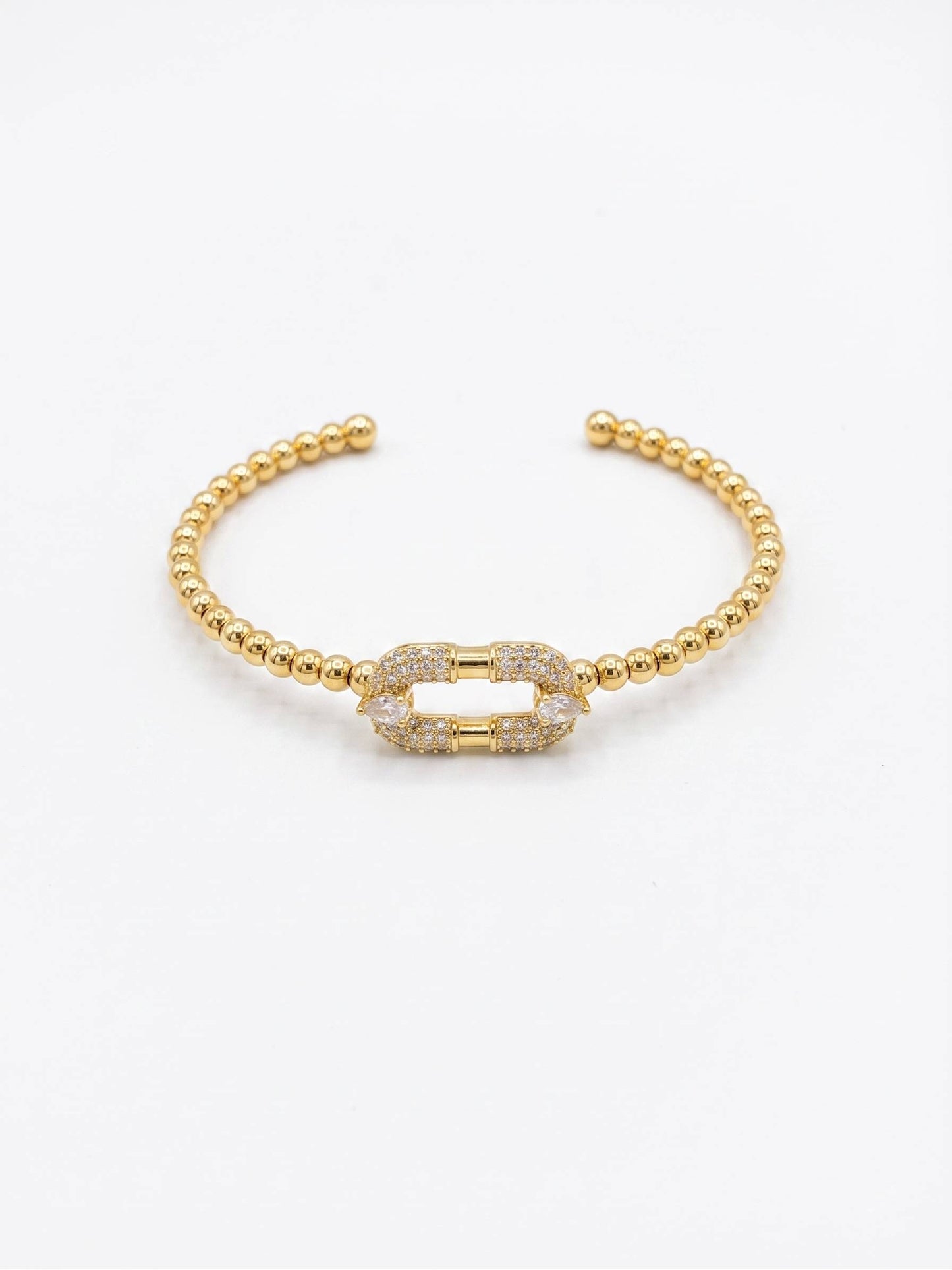 Close-up of Gold Beaded Bracelet with Crystal Link