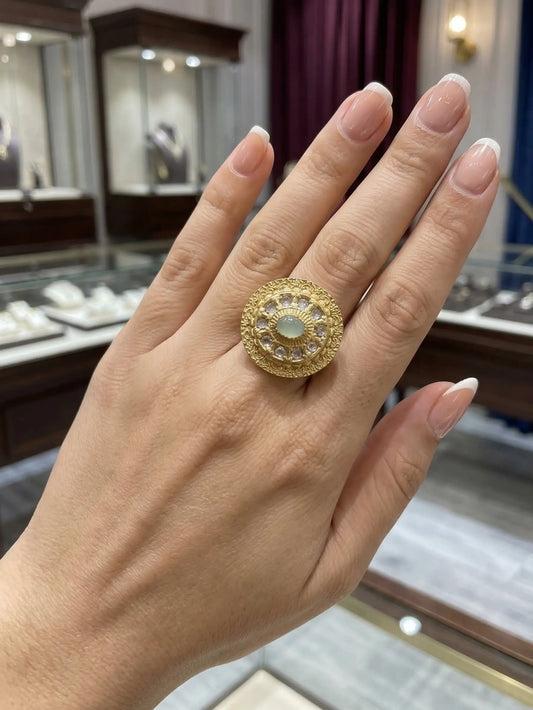 Elegant ladies' ring with a mint green gemstone worn on a female hand, showcasing its premium fashion jewelry design for weddings and parties.