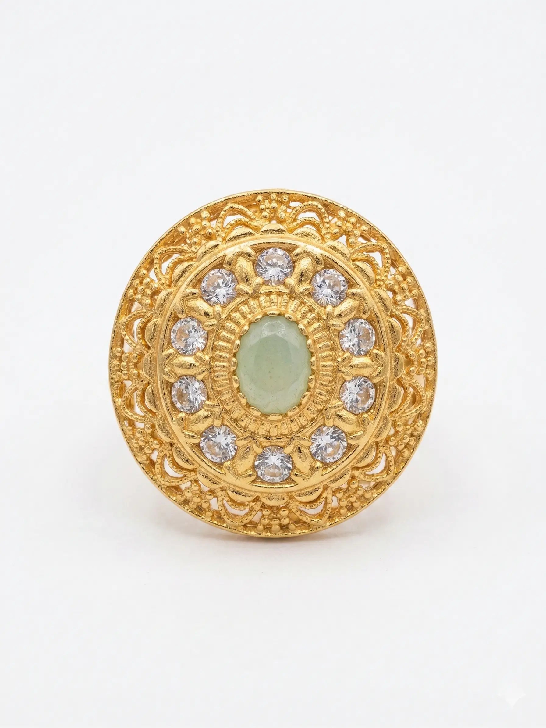 Luxury gold-finish stone ring for women, ideal for engagement or bridal wear, featuring a serene mint green center stone.
