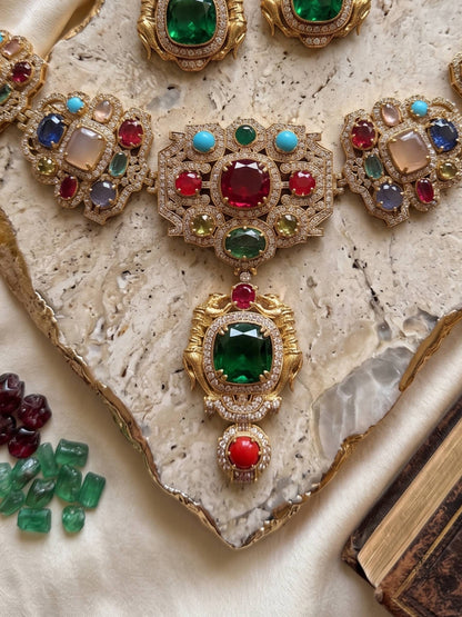 Ornate necklace with gemstones on a textured surface