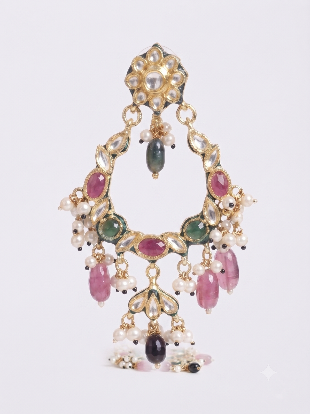 An ornate gold-toned traditional Indian choker necklace decorated with white pearls, pink and green stones, and dangling pink teardrop beads, shown against a light gray background.