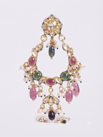 An ornate gold-toned traditional Indian choker necklace decorated with white pearls, pink and green stones, and dangling pink teardrop beads, shown against a light gray background.