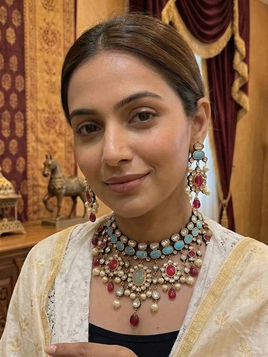 Woman wearing elaborate jewelry in an ornate indoor setting