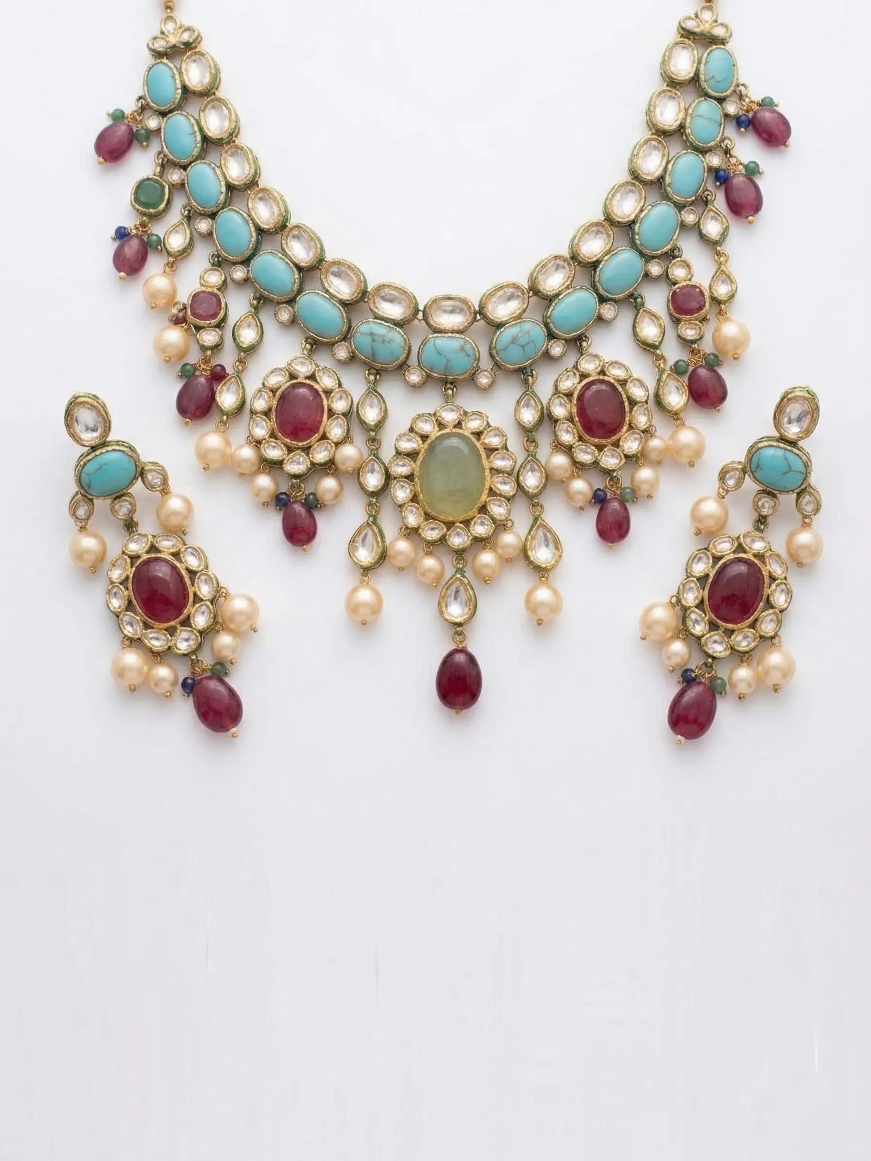 Jewelry set with necklace and earrings on a white background