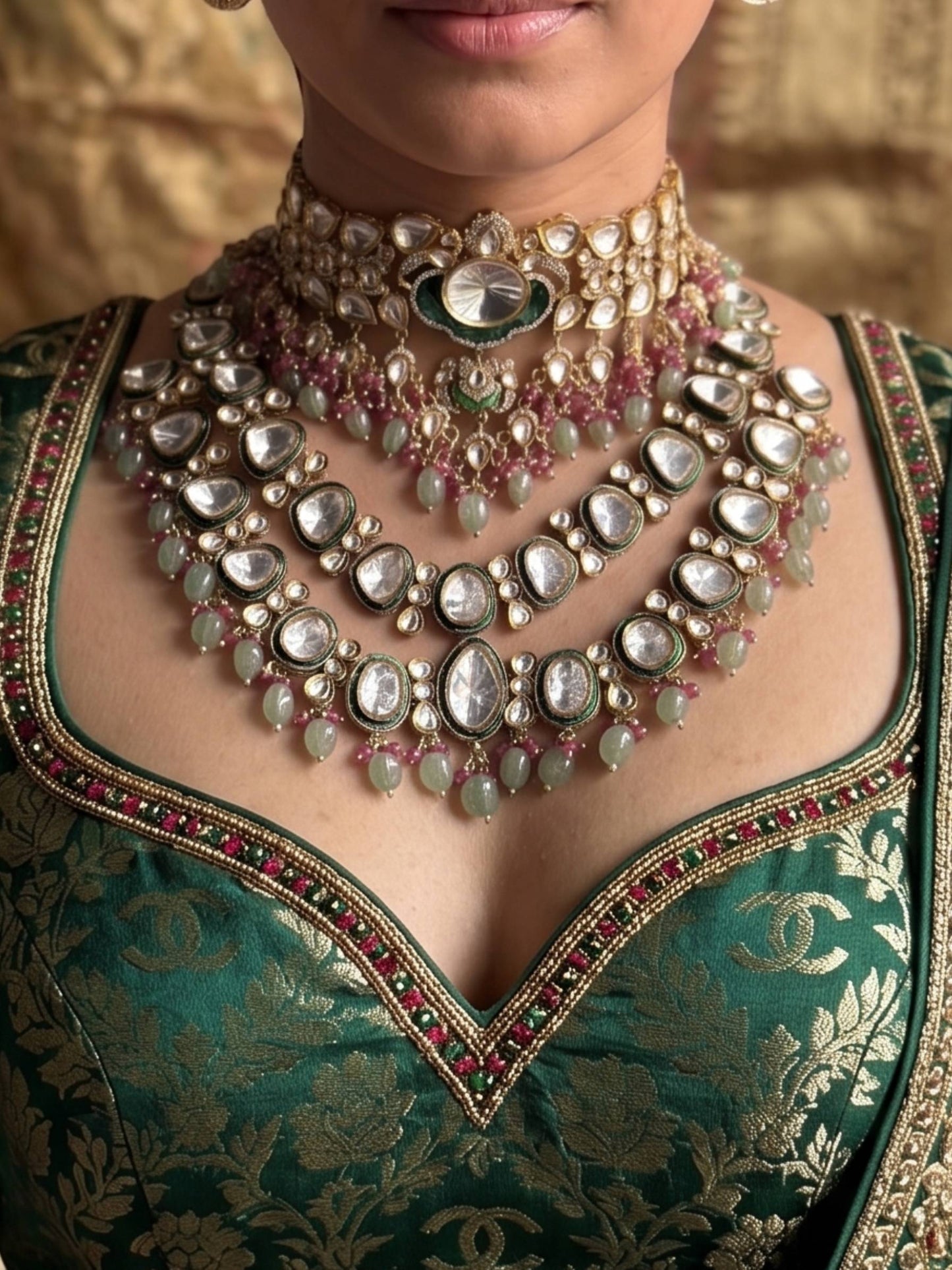 Close-up of a person wearing an ornate necklace and traditional outfit with intricate designs.