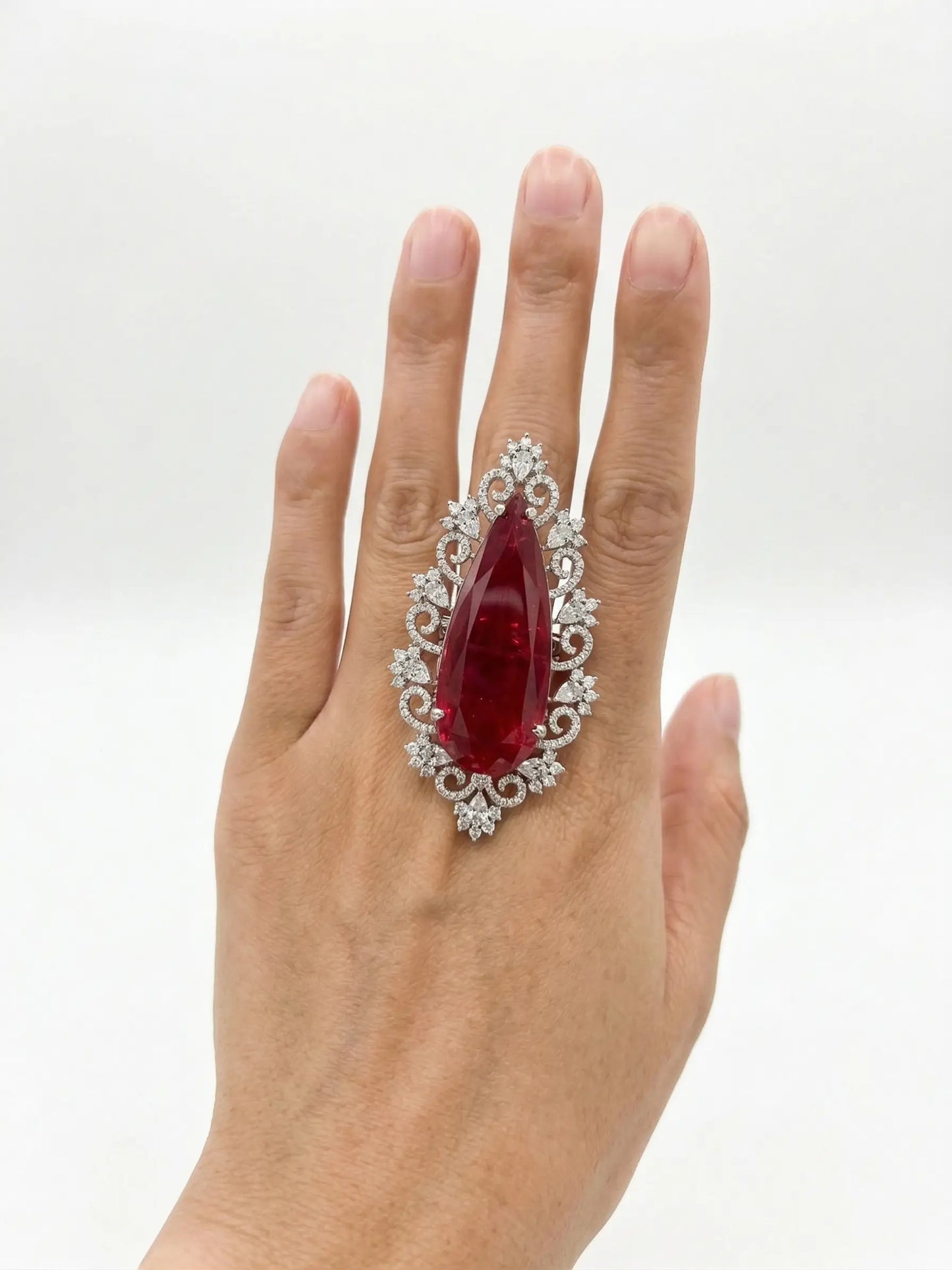 Close-up of a statement red CZ ring, a perfect choice for female engagement rings or weddings.