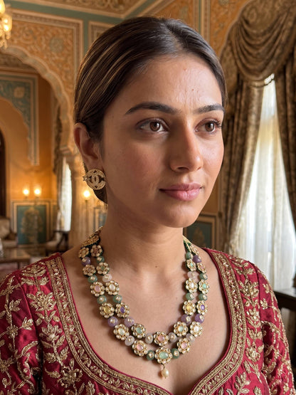 Woman wearing traditional jewelry in an ornate room