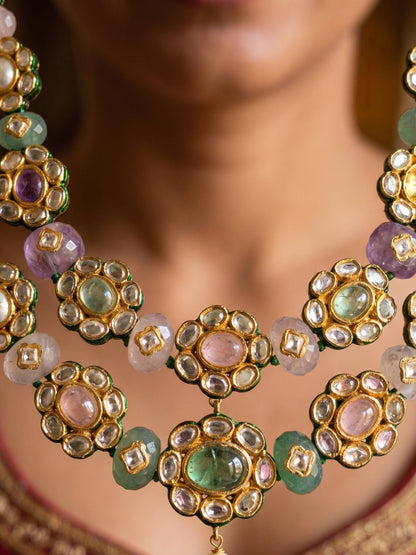 Close-up of a ornate necklace with gemstones on a blurred background