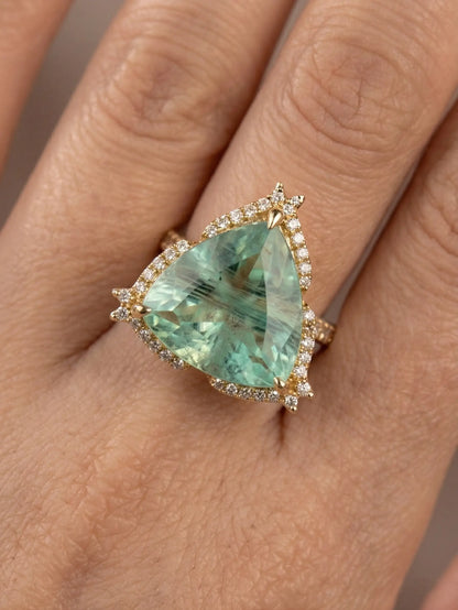 Trillion cut green color stone ring with golden finish