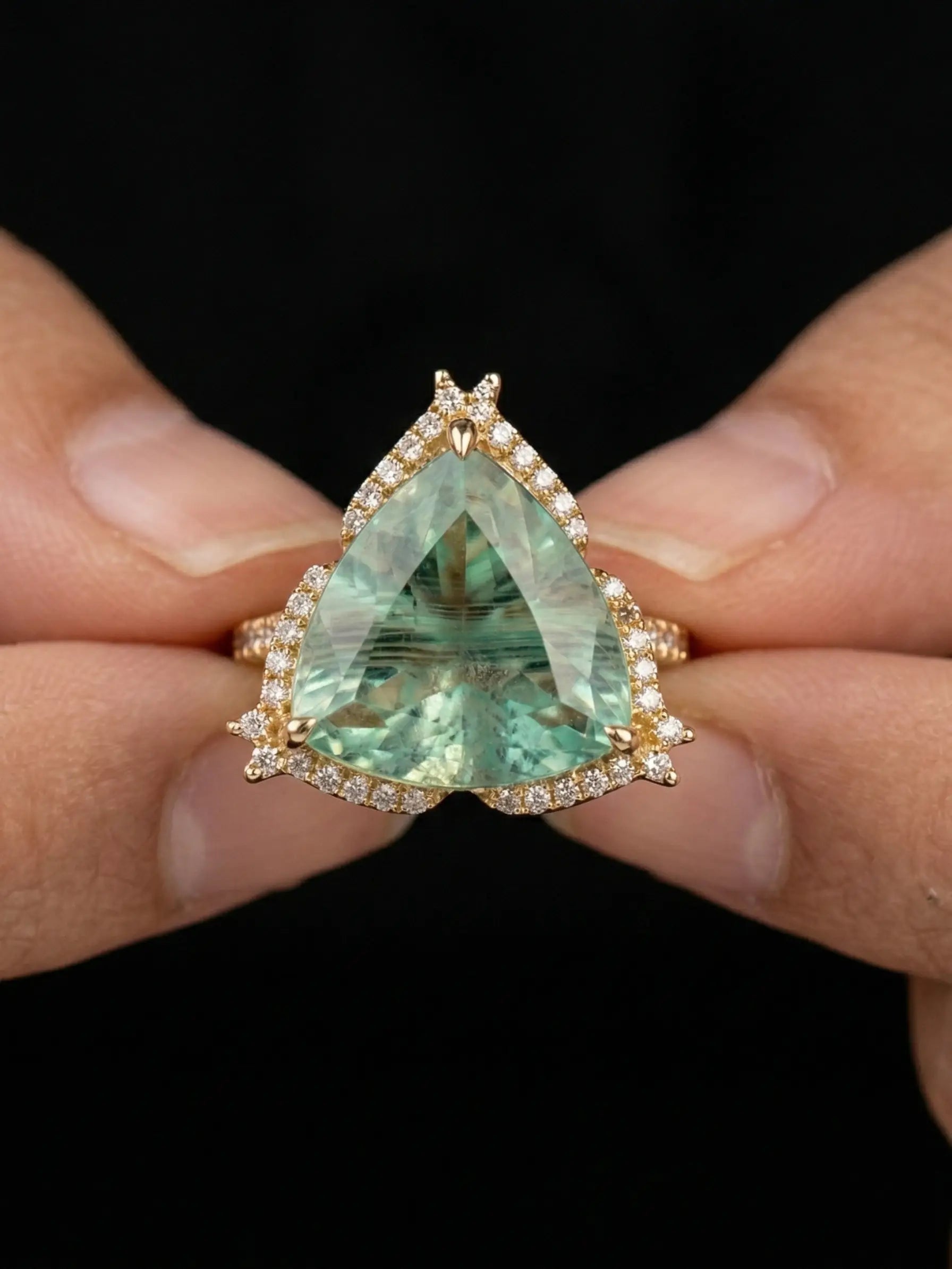 Vintage golden ring design with sparkling zircon halo