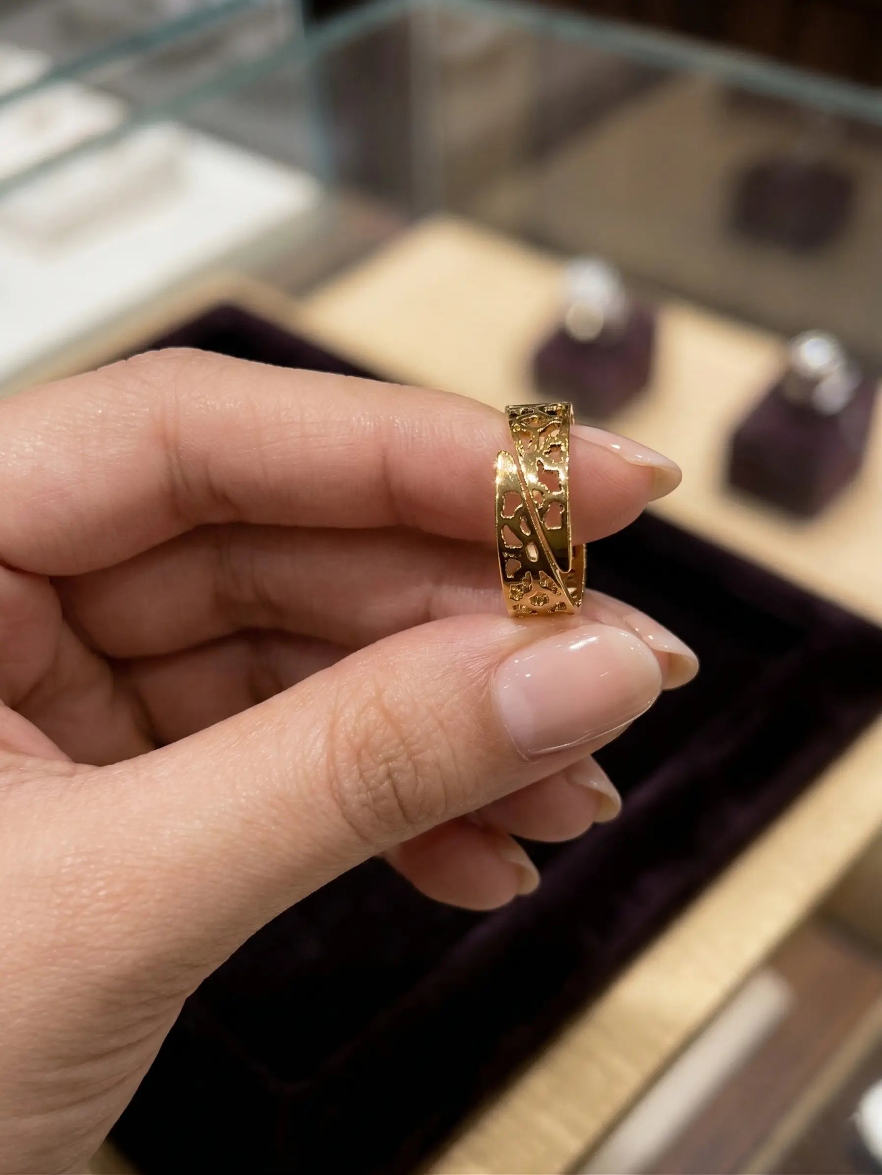 Trillion cut green color stone ring with golden finish adjustable size