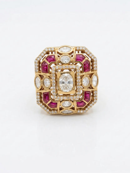 Gold ring with red gemstones and clear stones on a white background