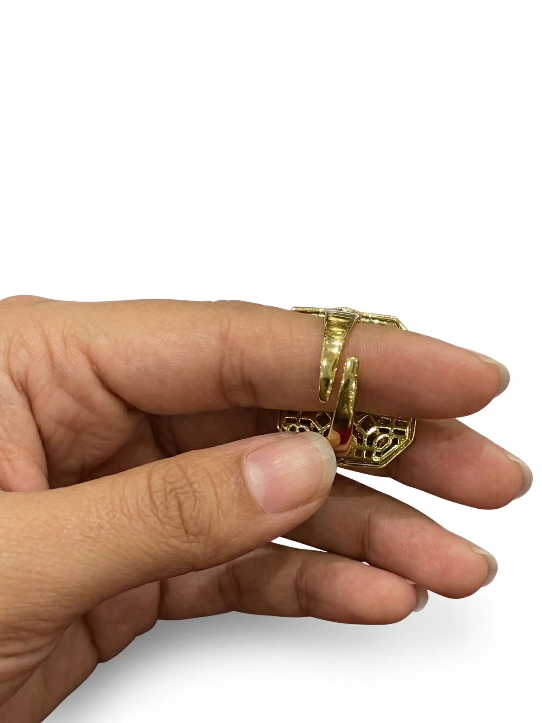 Hand wearing a gold ring on a white background