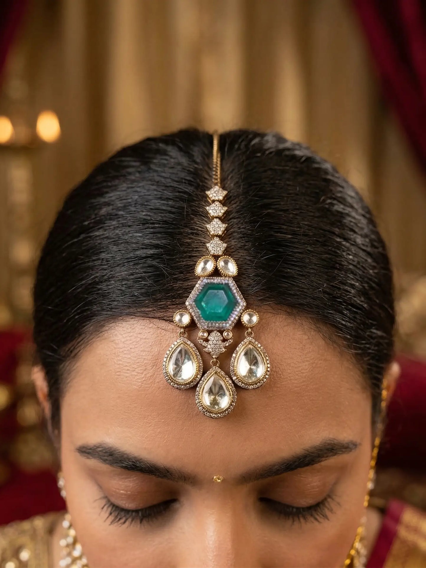 Close-up of a woman wearing a decorative hairpiece with gemstones against a blurred background.