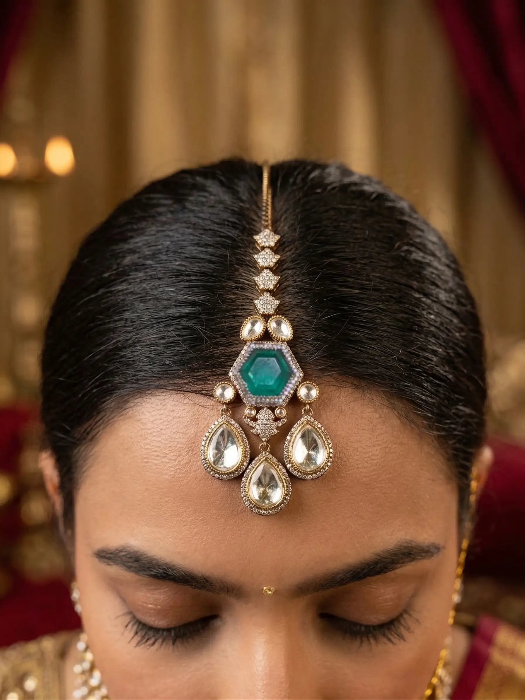 Close-up of a woman wearing a decorative hairpiece with gemstones against a blurred background.