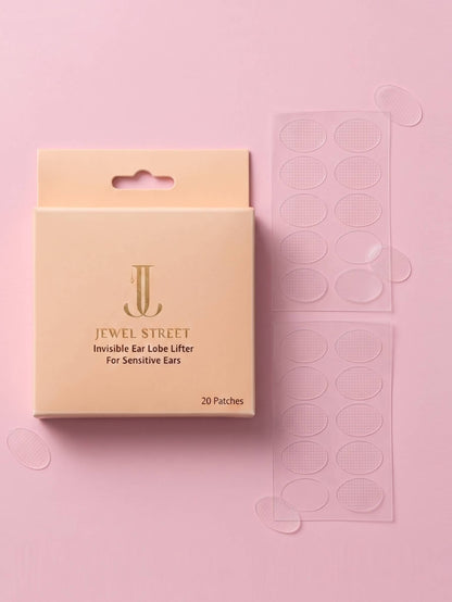 Jewel Street invisible ear lobe lifter packaging on a pink background