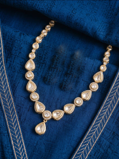 Pearl necklace on a blue fabric background