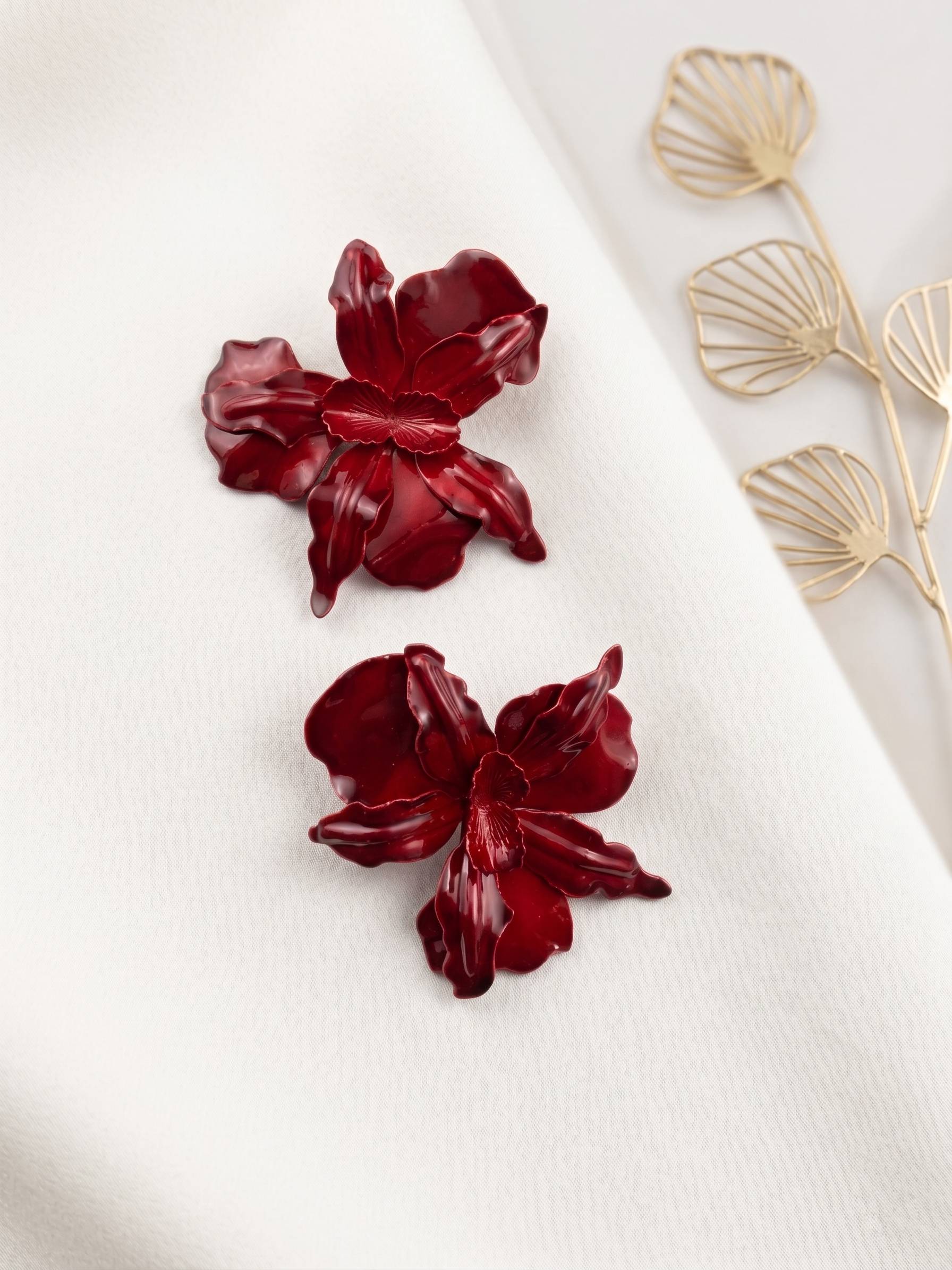 Large-scale orchid earrings tops for women in a stunning crimson hue.