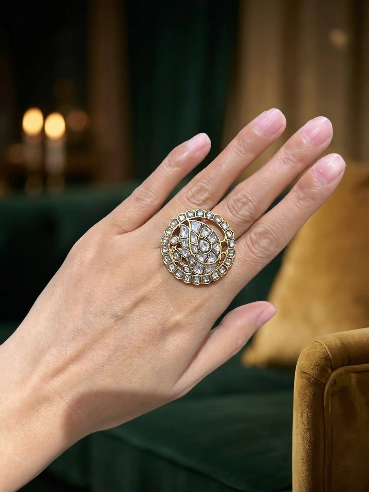 Side view of a traditional Indian Polki ring for ladies featuring intricate kundan work on a gold-plated band
