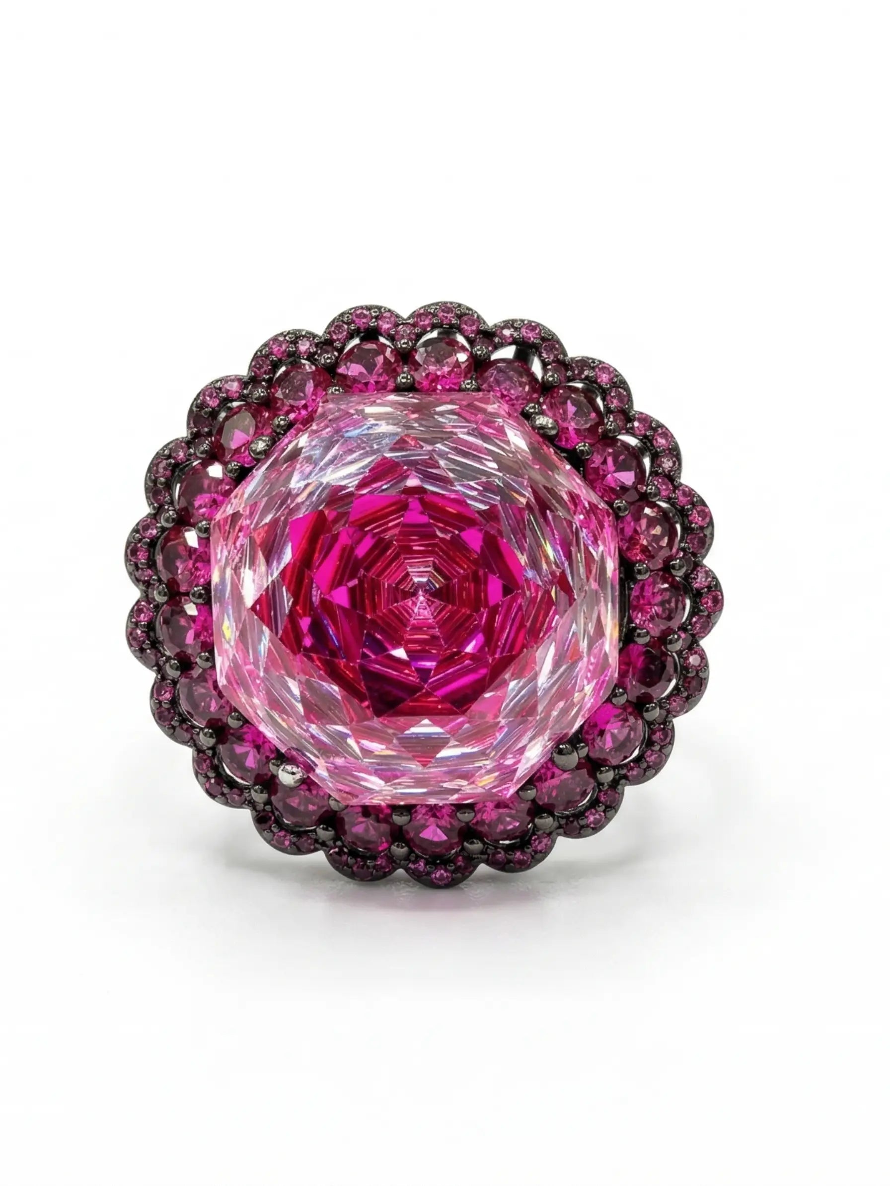 Clean product shot of the adjustable double-loop band, showing the intricate, dark rhodium plated filligree cage that holds the large pink stone ring for women