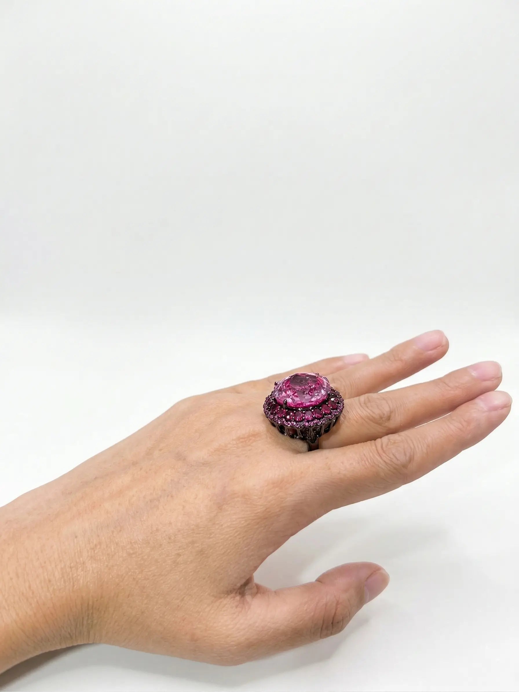 This Swarovski ring for women uses dark metal setting for high-fashion appeal, highlighting the geometric facets and perfect clarity of the center crystal