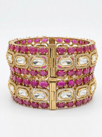 ruby bracelet with pink and clear gemstones on a white background