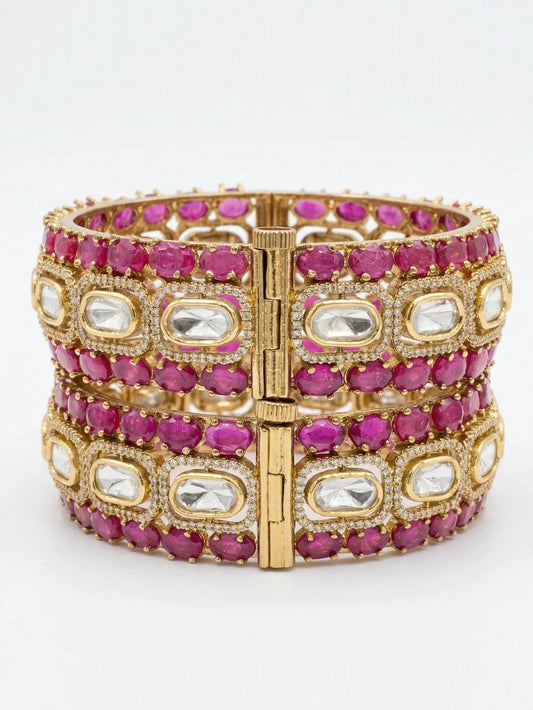 ruby bracelet with pink and clear gemstones on a white background