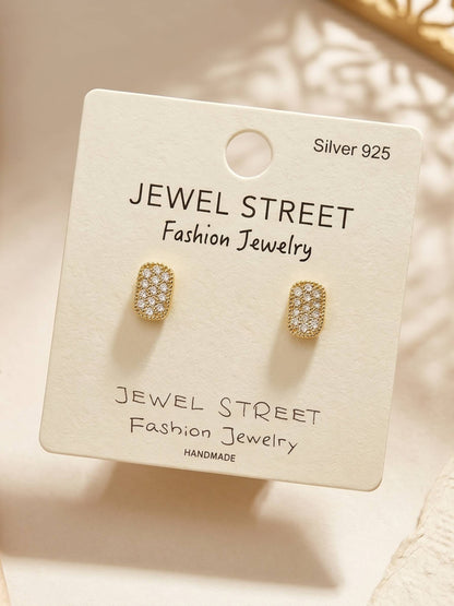 Gold earrings on a Jewel Street branded card with a soft background